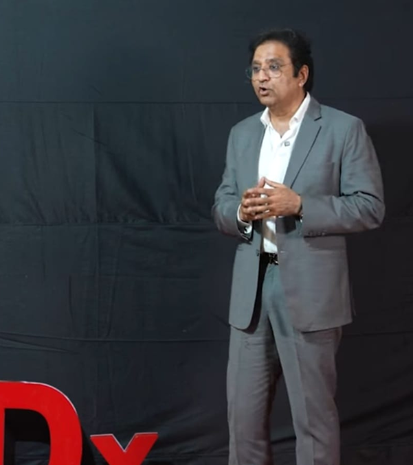 Dr. Hemant Sharma speaking on TEDx Stage